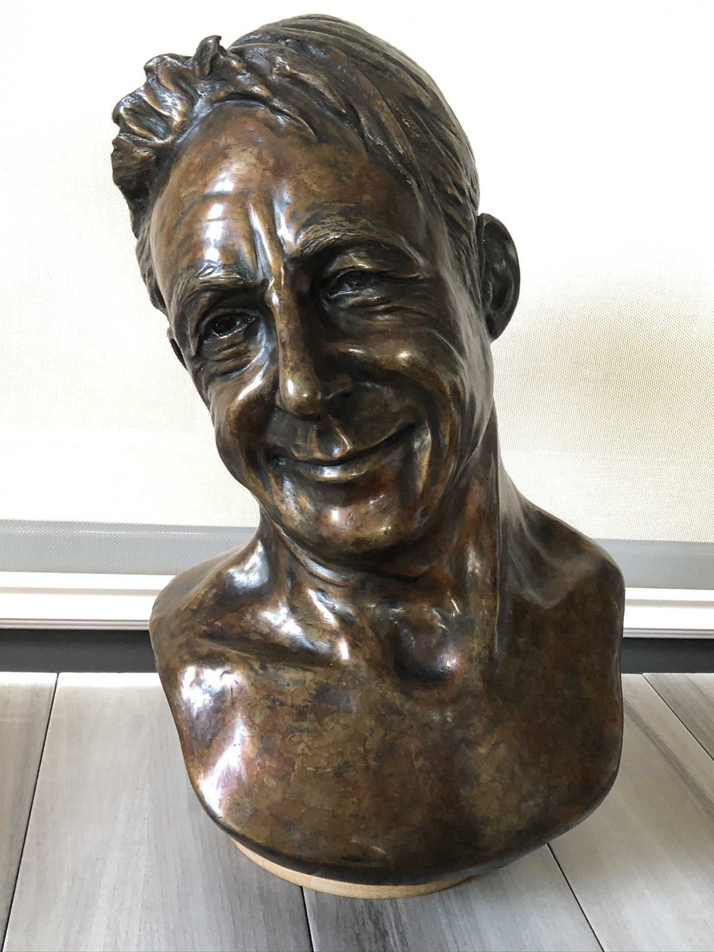 Linda Barabé — bronze portrait bust of a smiling man